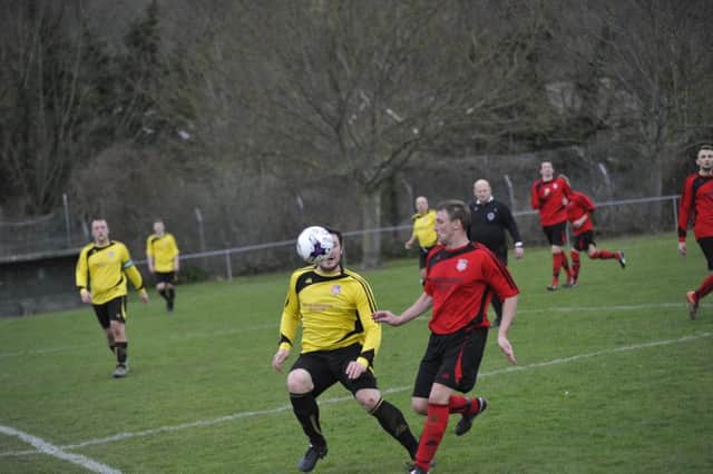 Two-goal Rob Levett in the thick of the action.