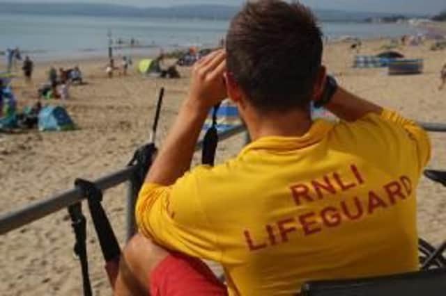 RNLI Lifeguard on duty SUS-160826-114717001