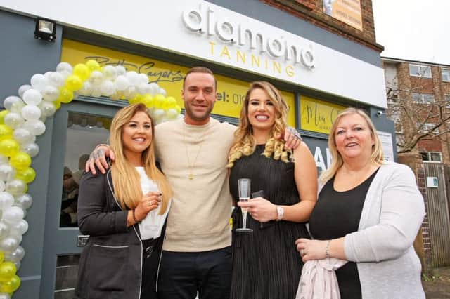 DM17313248a.jpg. Calum Best opens the Diamond Tanning Studio in Worthing. Pictured with, L to R Beth Sayers, Lois Hallett and Bernadette Cumins. Photo by Derek Martin. SUS-170318-192437008