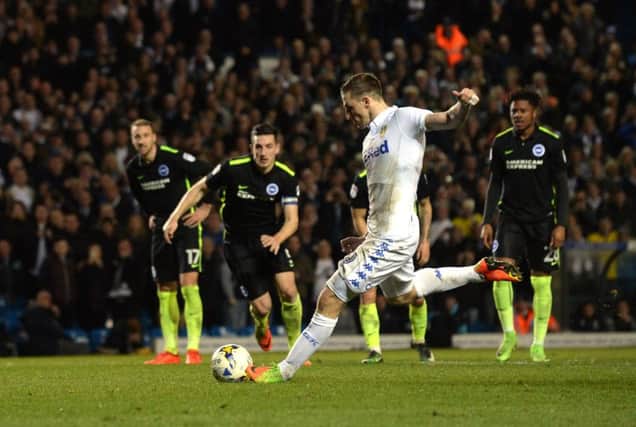 Leeds' Chris Wood slams home from the penalty spot against Albion on Saturday. Picture by Bruce Rollinson