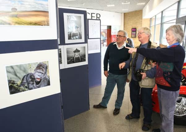 Adur Photographic Society chairman Alan Carter with visitors Alan and Virginia Carter. Pictures: DM17314136a