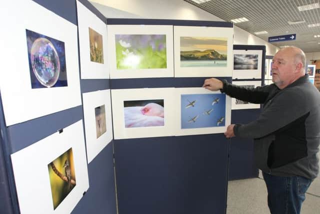 Adur Photographic Society member Rob Carter at the exhibition DM17314110a