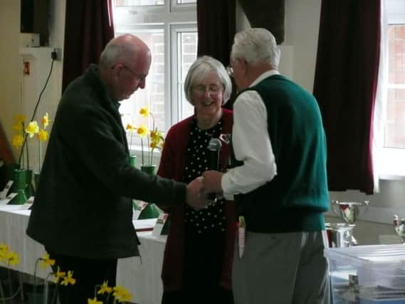 President John Franklin presents Jim Gray with the Terry Clough Cup for most points in the daffodil classes