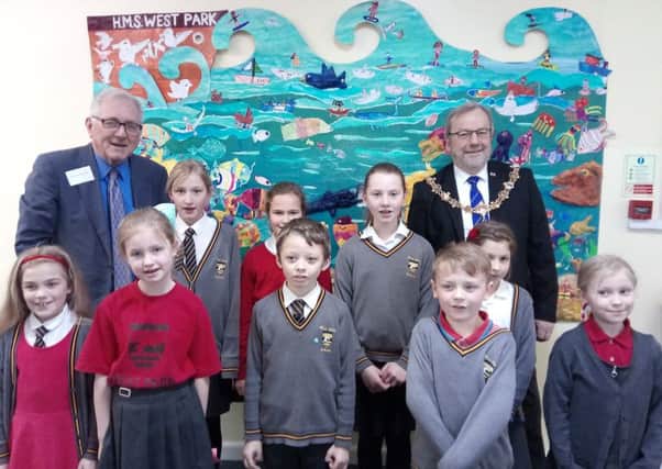 Worthing West MP Peter Bottomley and Worthing mayor Sean McDonald with pupils by Shimmering Sea, one of the five murals