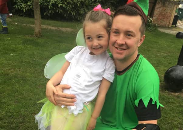Maggie Barker, five, and dad Richard dressed as Peter Pan and Tinkerbell for the run