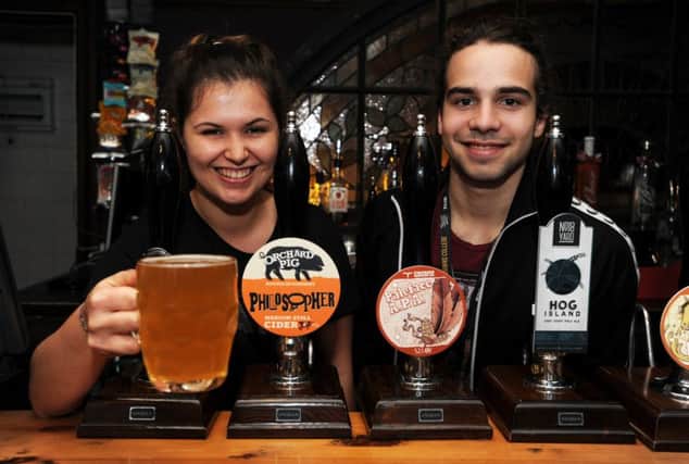 Natalie Cook and Jose Nobrega at The Eagle raise a glass to pub business rates cuts
