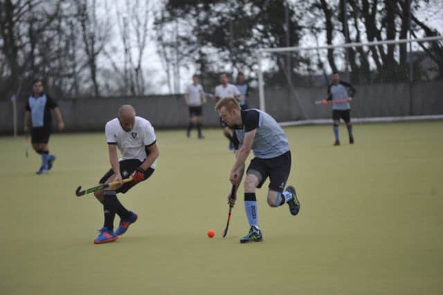 Tudor Stainsby tries to take on a Horsham II opponent. Pictures by Simon Newstead