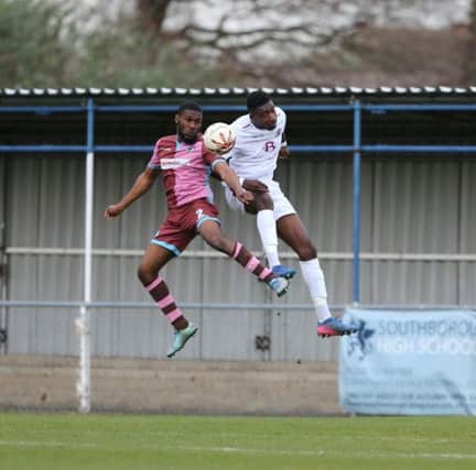 Shomari Barnwell goes up for a header during Hastings United's 1-0 win away to Corinthian-Casuals last weekend. Picture courtesy Scott White