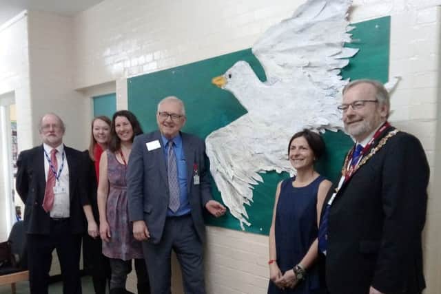 With the seagull mural, from left, deputy head Malcolm Howie, head teacher Caitriona Bull, Creative Waves director Vanessa Breen, Worthing West MP Peter Bottomley, Creative Waves director Nadia Chalk and Worthing mayor Sean McDonald