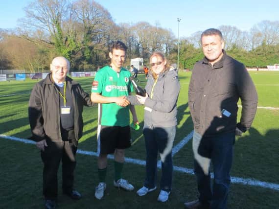 Lucas Rodrigues picks up the Man of the Match award. Picture courtesy of Burgess Hill Town FC