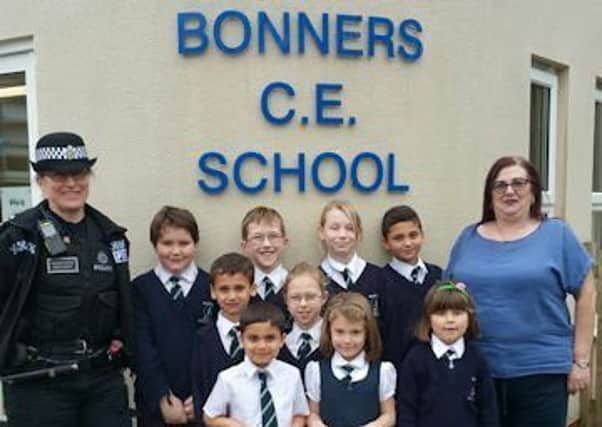 Rose Hanson and Nicki Kaufman with some pupils at the school. Picture: Sussex Police SUS-170326-120825001