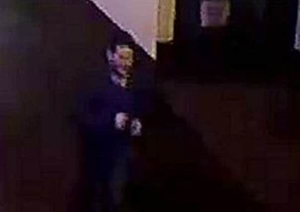 Officers released grainy CCTV of a man they wish to speak to in connection with the St Patrick's Day assault