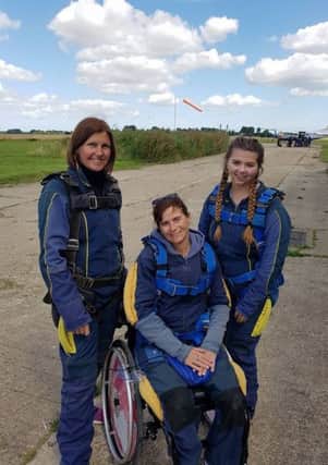 Amanda with her friend and eldest daughter Meg, marking the anniversary of her accident with a skydive