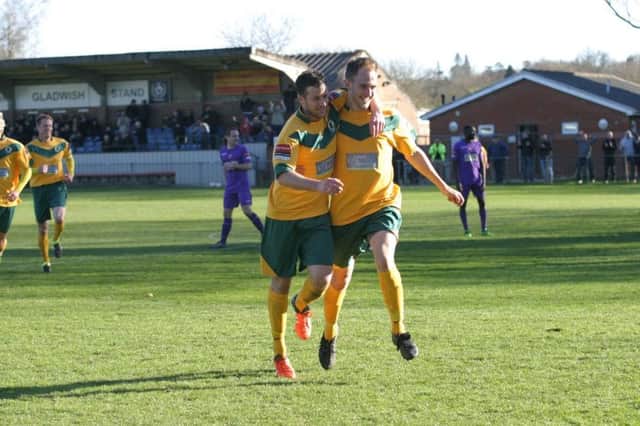 Horsham`s Charlie Farmer (right) celebrates his goal against league leaders Tooting & Mitcham on Saturday. Photo by Clive Turner