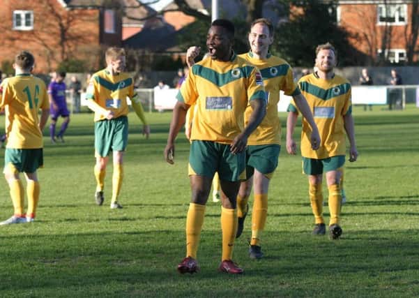 Horsham`s Tony Nwachukwu (centre) celebrates his goal, also pictured is Charlie Farmer whom scored Horsham`s first goal. Photo by Clive Turner
