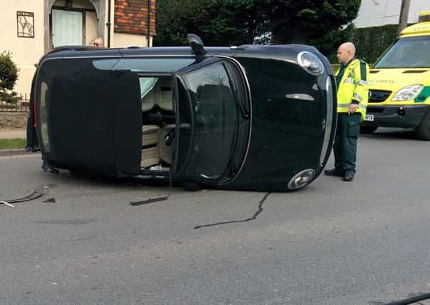 Car flips in crash in Storrington