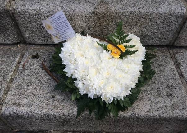 Flowers left in Parliament's New Palace Yard