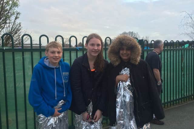 Luke Gausden, Isabella Spicer and Kiran Sandhu, all 12, at the scene of the fire at The Weald School in Billingshurst. Picture: Anna Khoo