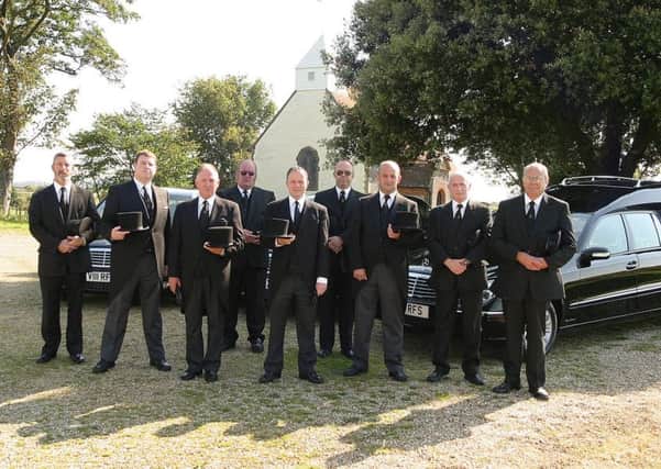 Funeral director Michael Wileman, third left, in 2004, when Reynolds took delivery of the new fleet of Mercedes Hearses