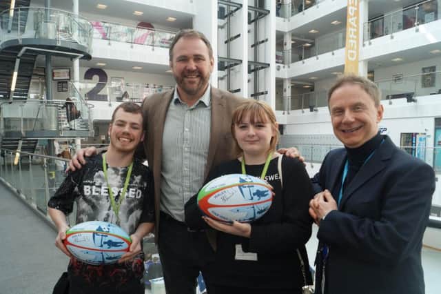 Scott Quinnell with students Connor Brown and Charley-Louise Burlace SUS-170329-103013001