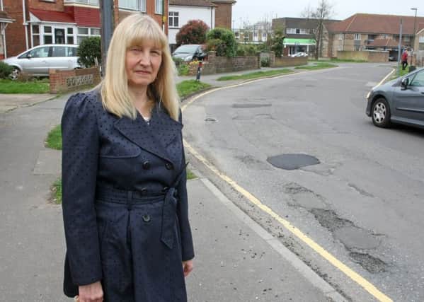 Sandra Maplesden fears the potholes, recently repaired for the second time, will collapse again