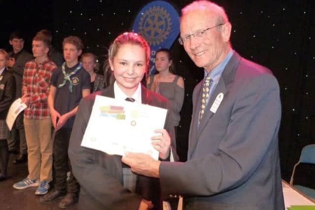 Bognor Regis Rotary Club president Dr Malcolm Ridley presents a certificate to winner Emma Warburton