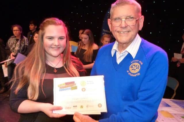 John Mitchell from Littlehampton Rotary Club presents a certificate to Paige Jones, a nominee in the 13 to 15 years category