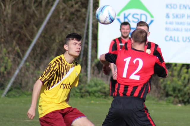 Bradley Pritchard tussles for possession against Saltdean. Picture courtesy Catherine Gurney