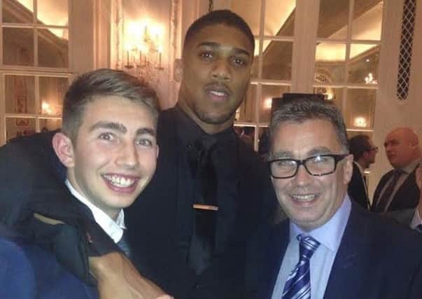 Sam and Ian Hart (left and right respectively) with Anthony Joshua