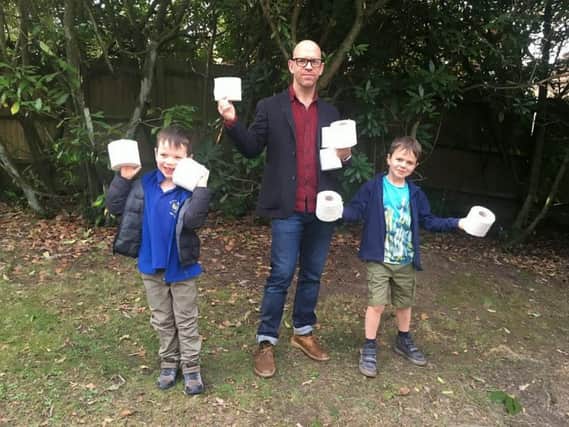 Left to right Leo Harvey, 5, his dad Nick Harvey, 45, and Felix Harvey, 8 outside St John's Primary School in Crowborough. Photo from SWNS SUS-170331-140552001