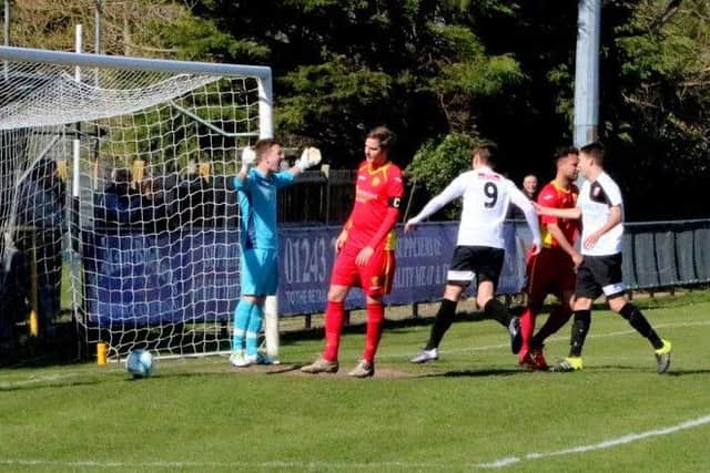The ball is in the net and Pagham are ahead against Newhaven / Picture by Roger Smith