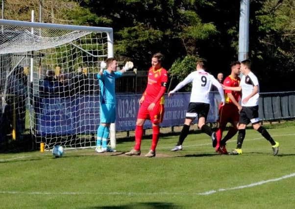 The ball is in the net and Pagham are ahead against Newhaven / Picture by Roger Smith