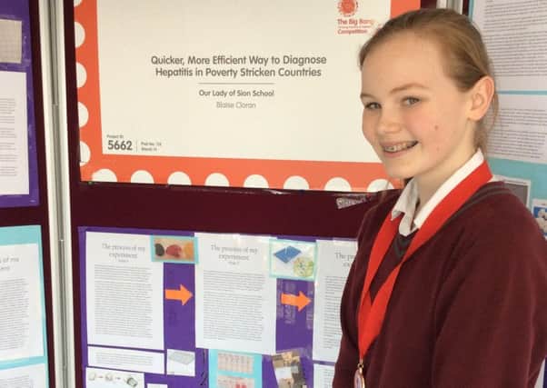 Our Lady of Sion School student Blaise Cloran with her project, A Quicker More Efficient Method of Diagnosis for Hepatitis