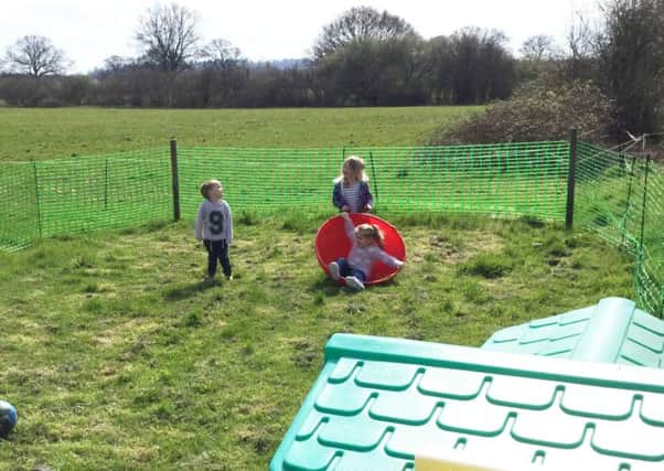 Youngsters at Bobtails Nursery enjoying the great outdoors before the temporary fence was removed from their play-spot SUS-170304-105924001