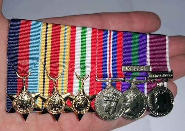 Military medals found in a cemetery in Roffey, Horsham SUS-170304-115610001