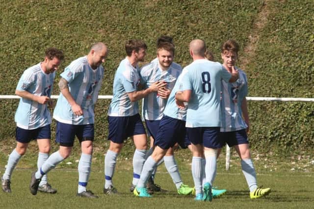 Worthing players celebrate. Picture by Derek Martin