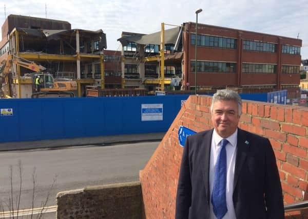 Councillor Neil Parkin at the site as demolition continues