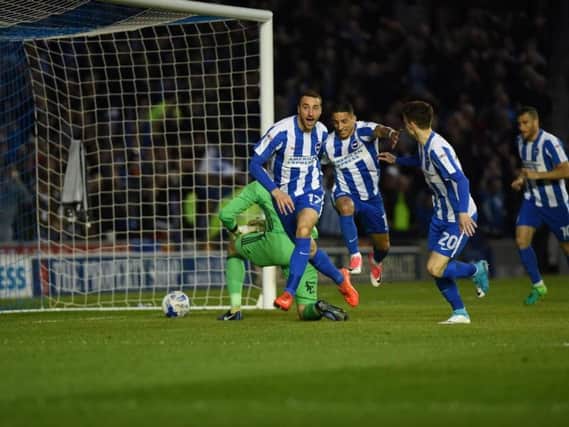 Glenn Murray wheels away in celebration at his opening-minute goal against Birmingham. Picture by Phil Westlake