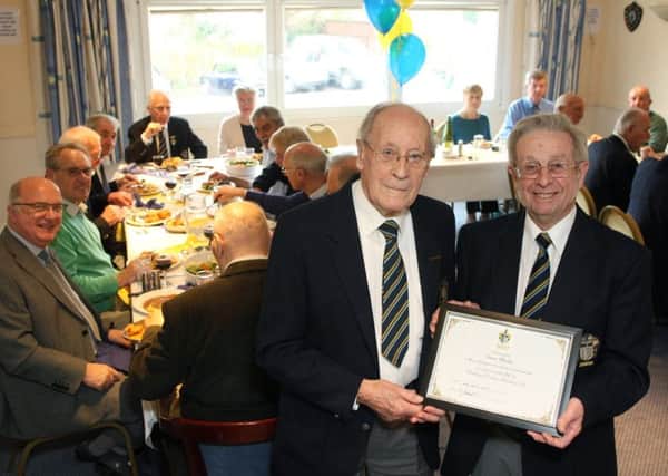 Dennis Wheatley celebrates 50 years at Worthing Pavilion Bowling Club and receives a certificate from Charlie Carswell. Picture: Derek Martin DM17417222a