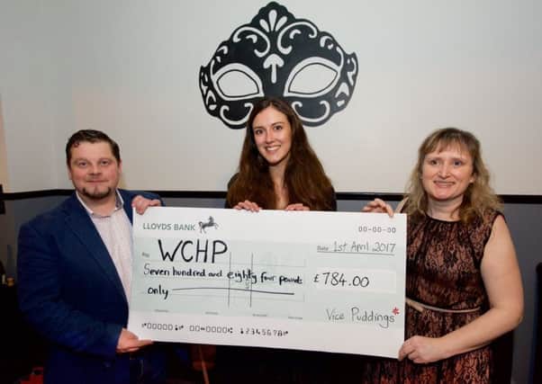 Jonathan Nulty and Rosanne Fleming present the cheque to Rachel Blair, centre. Picture: Martin Bloomfield