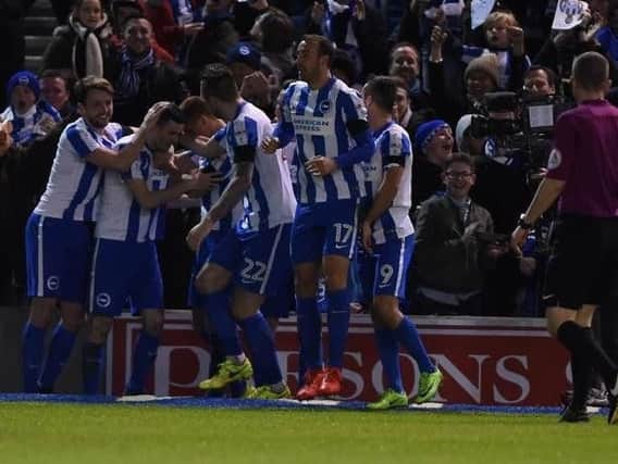 Together: Brighton & Hove Albion players celebrate. Picture by Phil Westlake