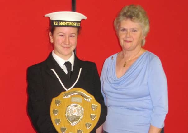 Amy Bruce is presented with cadet of the year by Aldwick Royal Legion representative Jenny Farrell