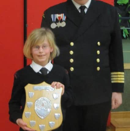Hollie Goodland is presented with best new entrant by chief of staff Captain Stuart Ginnaw