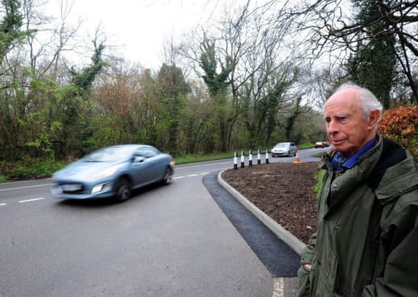 Derek Stewart Smith who is  concerned  the work that has been carried out on the A285 at the Eartham turn causes cars to veer into the centre of the road  ks170812