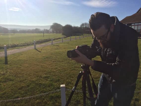 Freelancer Dan Davies filiming fot Lewes-based Chalk TV SUS-170604-093410001