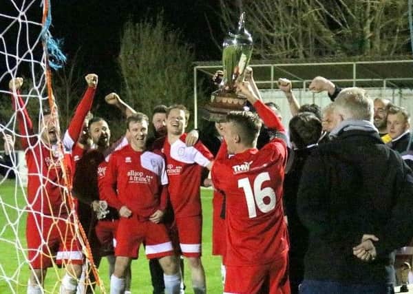 Nyetimber Pirates Reserves celebrate the cup win / Picture by Roger Smith