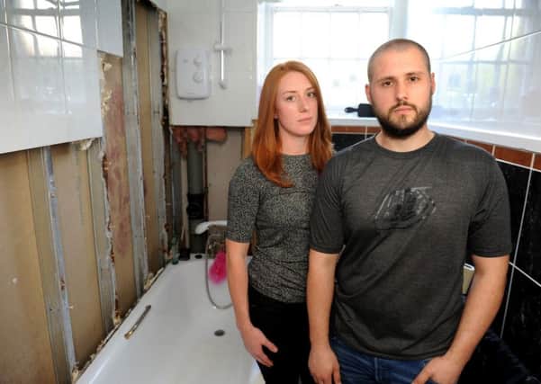 Alan Greenwood and Sarah Sweatman in their damp and mouldy flat at Lockhart Court, Haywards Heath. Pic Steve Robards SR1706587 SUS-170804-110726001