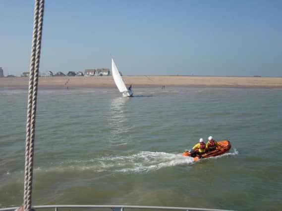 The lifeboat crew going to help rescue the yacht