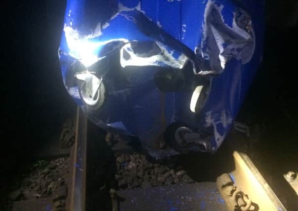 The bin was thrown onto the tracks near Hove station (Photograph: British Transport Police) SUS-171004-125055001
