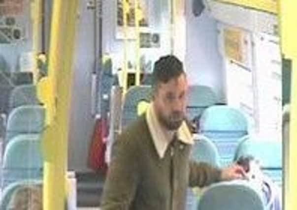 Police are looking to speak to a man in connection with a theft of a laptop on a train.